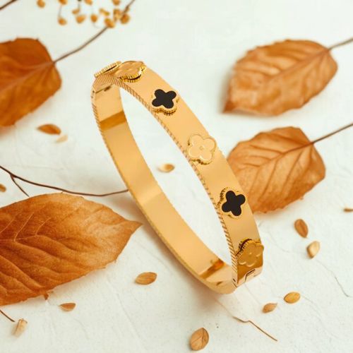 Gold Floral Motif Bracelet with Black Enamel Accents